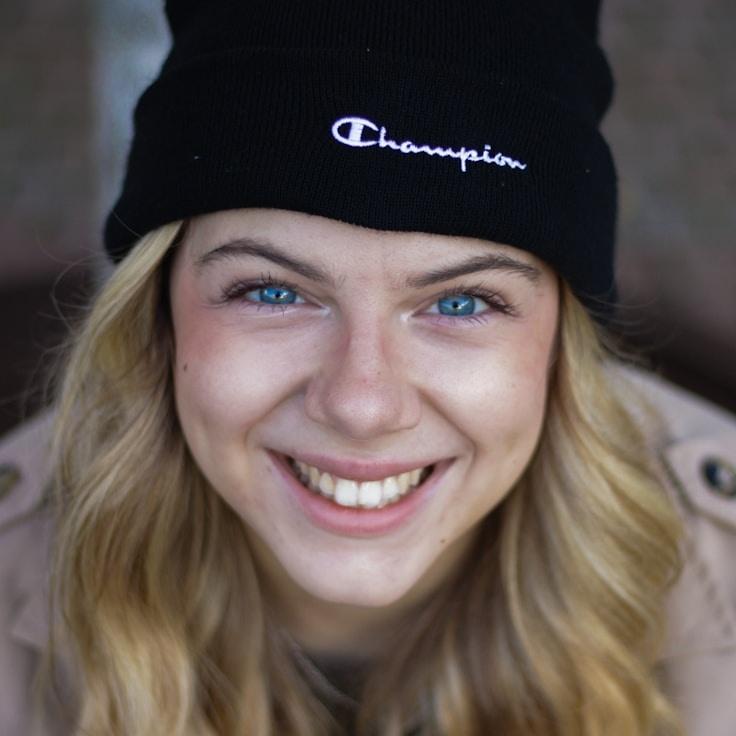 Alex Rivera, Lead Design Curator at Veloci Trace Tech, reviewing corporate floral arrangements